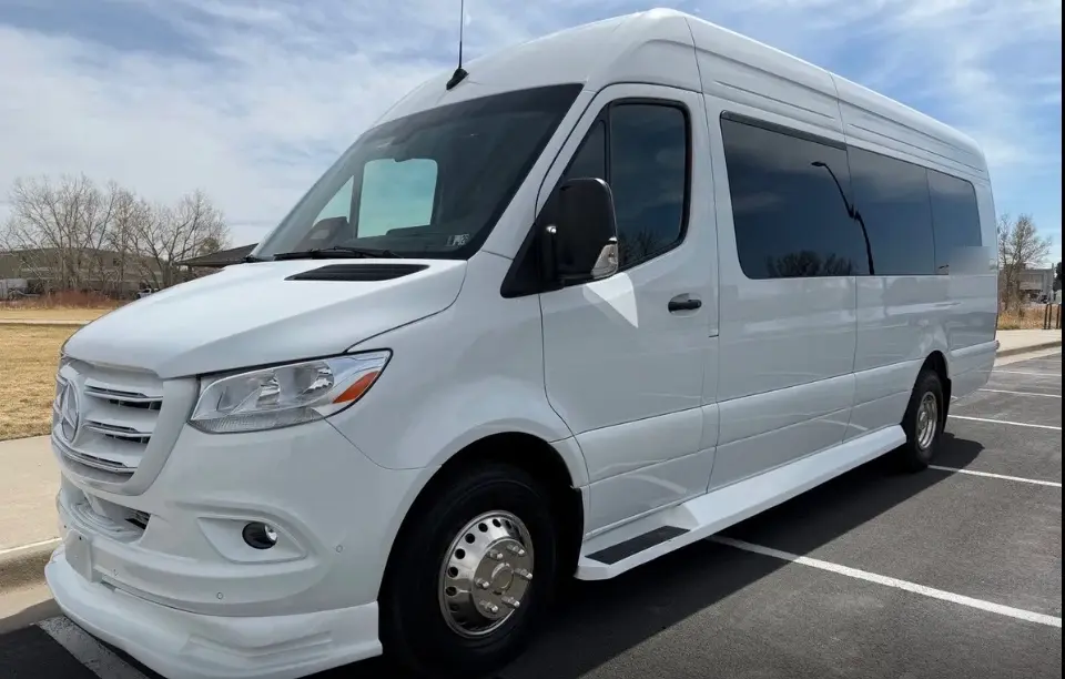 Arvada 16 passenger white Sprinter limo bus